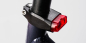 Preview: SON Rücklicht Sattelschelle 31,8 mm schwarz/rot für Dynamo